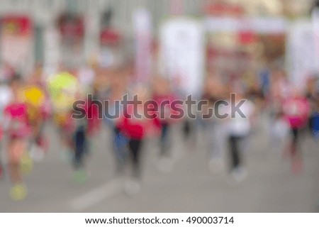 Blurry sport background - mass of people running on a street