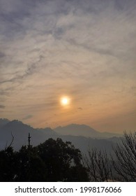 blurry sun behind the cloud's 