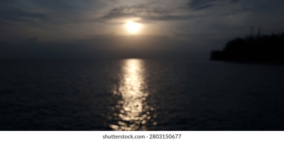 Blurry Sunset View From The Beach