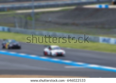 blurry of super car Racing speed of road background textures concept.