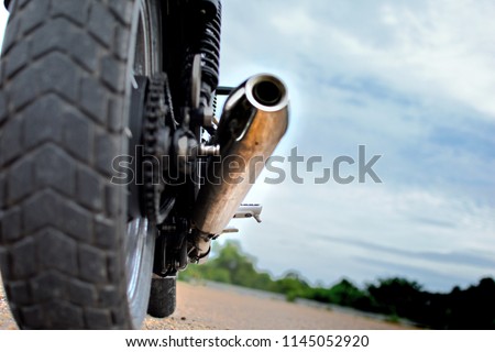 Similar – Image, Stock Photo Wheel and exhaust pipe of motorcycle on road