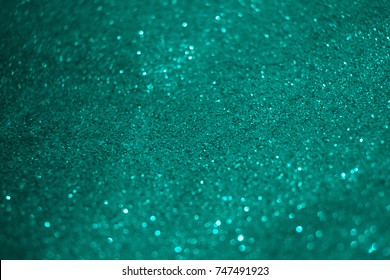 Blurry Turquoise Glitter Bokeh Background