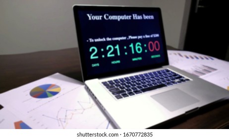 Blurry view of Hackers using adware fireball to control laptop computer using web browser search engine to spy and steal information. Internet security cyber attack hijack concept.