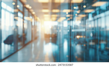 A blurry view of a modern office space with glass doors and windows, featuring natural light and bright colors. - Powered by Shutterstock