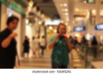 blurted people using a camera