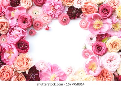 Blush floral frame with white background, peony, ranunculus, garden rose, dahlia, roses with red, peach, pink, magenta, fuchsia flowers - Shutterstock ID 1697958814