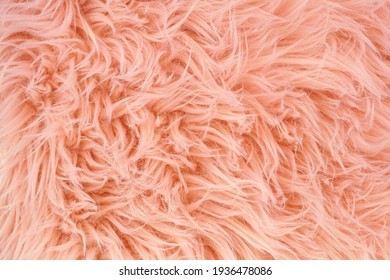 Blush fur fabric texture. Close up background with copy space.