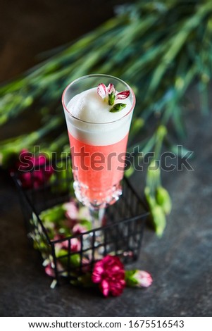 Blushing cranberry cocktail in a glass