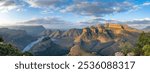 The Blyde River Canyon, a 26 km long Canyon in Mpumalanga, South Africa. On the right the Three Rondavels, three mountains very similar to the traditional African homesteads called rondavels