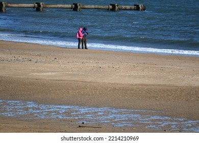 Blyth, Northumberland, England - September 24 2022: People Walking Along Beach At Blyth On Sunny Weekend Morning.