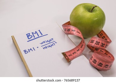 BMI body mass index formula rate in a notepad. BMI. Note written: BMI (body mass index) formula, health conceptual. Concept BMI body mass index formula rate formula, fitness and weight loss.