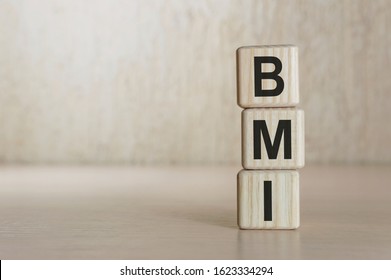 BMI Body Mass Index Letter Blocks On Wood Table