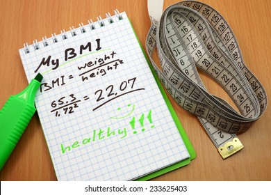 BMI. Measuring Tape, A Marker And A Notepad With A Body Mass Index Formula