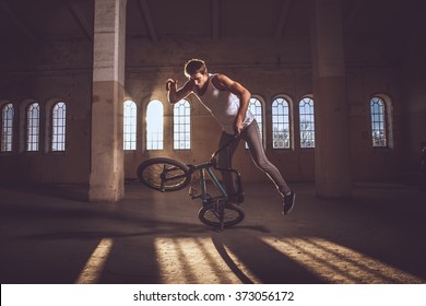 Bmx freestyle. A man on bmx doing tricks. - Powered by Shutterstock