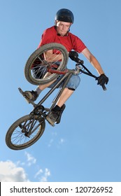 Bmx Rider Making A Bike Jump Called Table Top