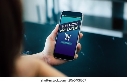 BNPL Buy now pay later online shopping concept.Hands holding mobile phone - Shutterstock ID 2063408687