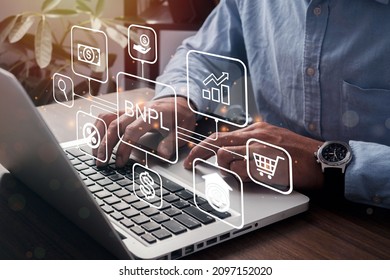 BNPL Buy now pay later online shopping concept. Businessmen using a computer to BNPL with online shopping icons technology. - Shutterstock ID 2097152020