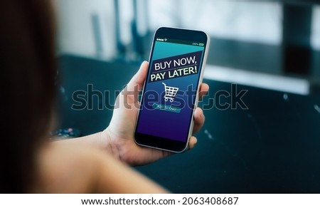BNPL Buy now pay later online shopping concept.Hands holding mobile phone