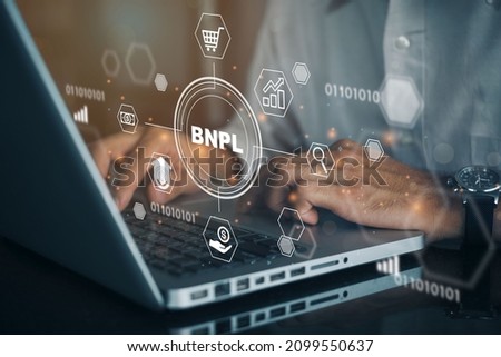 BNPL Buy now pay later online shopping concept. Businessmen using a computer to BNPL with online shopping icons technology.
