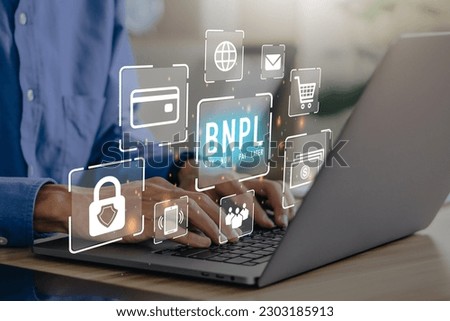 BNPL Buy now pay later online shopping concept. Businessmen using laptop with icons of BNPL.e-commerce.