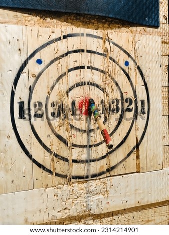 A board for axe throwing with scoring