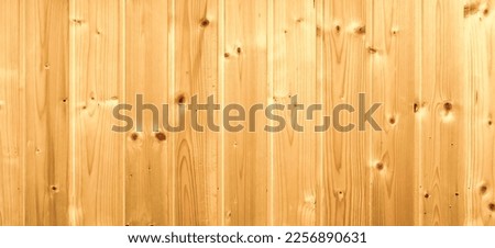 Board clapboard.Sheathing the walls of the sauna.Wooden texture.Wooden wall in the house as a background
