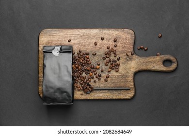 Board With Coffee Bag On Dark Background