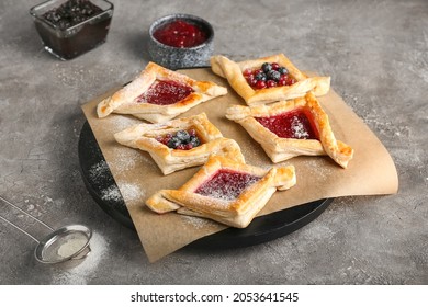 Board With Danish Pastry On Grunge Background