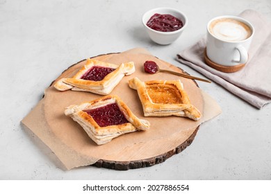 Board With Danish Pastry On Light Background