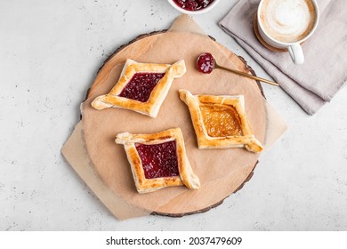 Board With Danish Pastry On Light Background