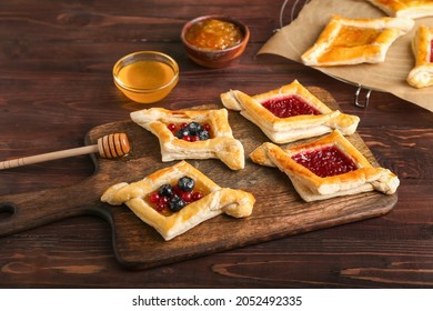 Board With Danish Pastry On Wooden Background