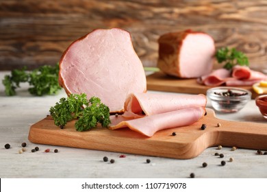 Board With Delicious Sliced Ham On Wooden Table