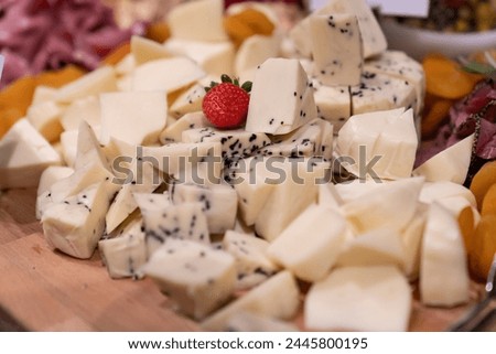 Board with different types of cheese: Dor blu, chedar, Parmesan, brie, honey sauce, finger bread and strawberry. Restaurant menu plate. cheese platter.
Roquefort cheese, mozzarella and parmesan.