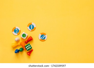 board game with cubes on an yellow background - Shutterstock ID 1742339597