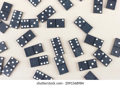 Board Game Dominoes On A Light Table. View From Above.