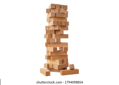 Board Game Jenga Tower Made Of Wooden Blocks. A Tower Of Unevenly Shifted Wooden Beams. A Lesson For Agility, Logic And Coordination. Home Entertainment. Balance. Close-up. Isolation, White Background