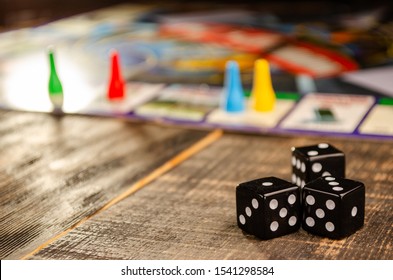 board game on a black wooden background with a sunbeam