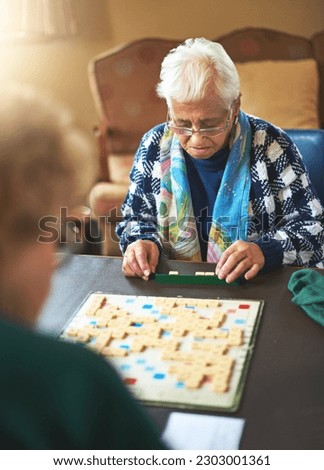 Board game, senior women and nursing home friendship or old people, thinking and play games together in retirement. Elderly friends, entertainment or hobby or table, retired and assisted living