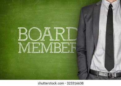 Board Member On Blackboard With Businessman In A Suit On Side