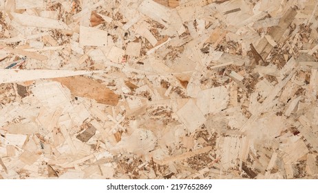 Board OSB Wooden Texture Background. 
Wood Shavings Compressed Wall Pattern.
(Oriented Strand Board) Top View.
Flat Lay.