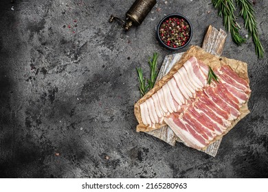 Board with raw bacon slices and rosemary. Healthy food, ketogenic diet, diet lunch concept. banner, menu, recipe place for text, top view. - Powered by Shutterstock