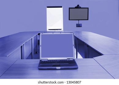 Board Room In Office Block With Laptop And Video Conferencing Equipment