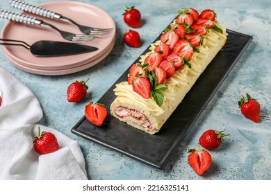 Board With Tasty Strawberry Roll Cake On Color Table