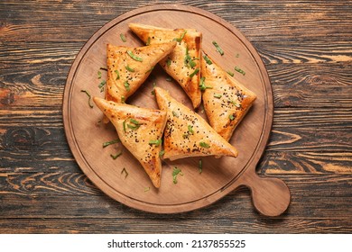Board with tasty Uzbek samsa on wooden background - Shutterstock ID 2137855525