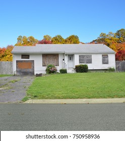 Boarded Suburban Ranch Home Blue Sky USA