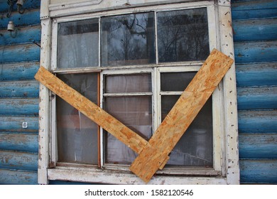 Boarded up window in an old house
 - Shutterstock ID 1582120546
