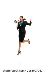 Boarding Announcement. Portrait Of Beautiful Young Woman, Flight Attendant Jumping With Megaphone Isolated On White Background. Model In Stewardess Uniform. Concept Of Business, Travel, Emotions