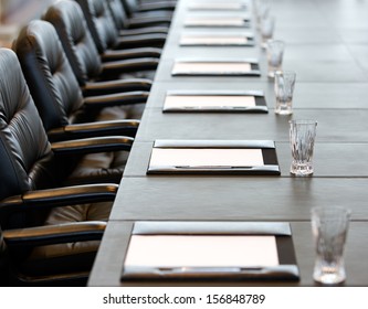 The boardroom table is set for the Annual General Meeting
