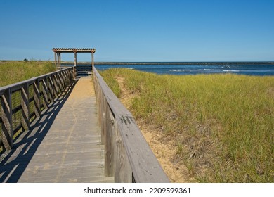Boardwalk across sand dunes towards Atlantic Ocean beach at Plum Island. North Point on Plum Island is where Atlantic ocean meets Merrimack river at mouth of Newburyport harbor - Shutterstock ID 2209599361