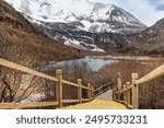 Boardwalk leading to Lake Gongga within the scenic and breathtaking Yading nature reserve Luorong Pasture, located in Garze Tibetan Autonomous Prefecture, Sichuan.